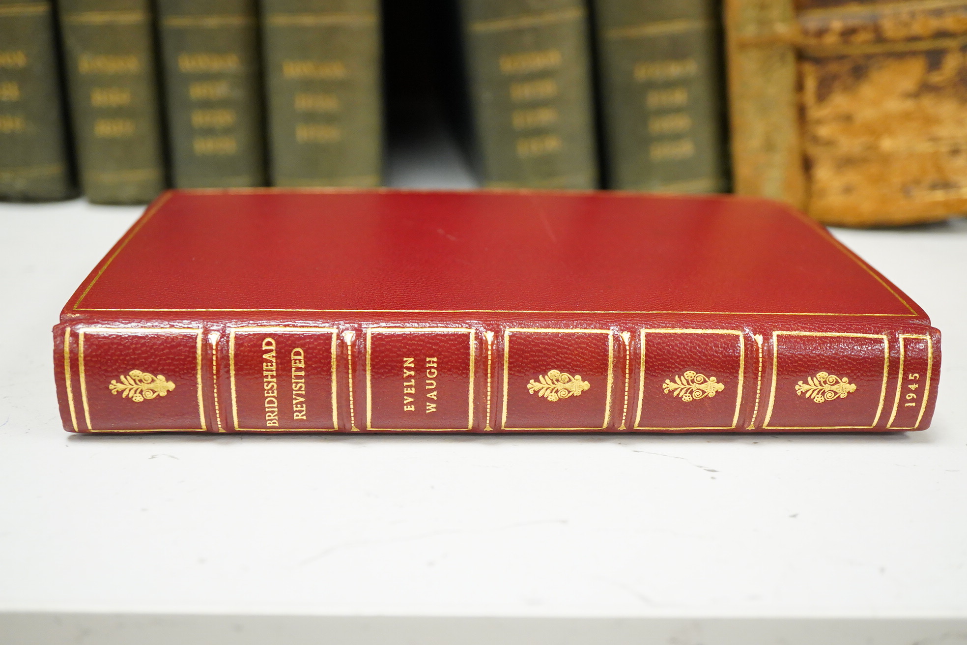 Waugh, Evelyn - Brideshead Revisited: the sacred and profane memories of Captain Charles Ryder ... first edition. half title; rebound gilt ruled red morocco, gilt decorated, ruled and lettered panelled spine, gilt decora
